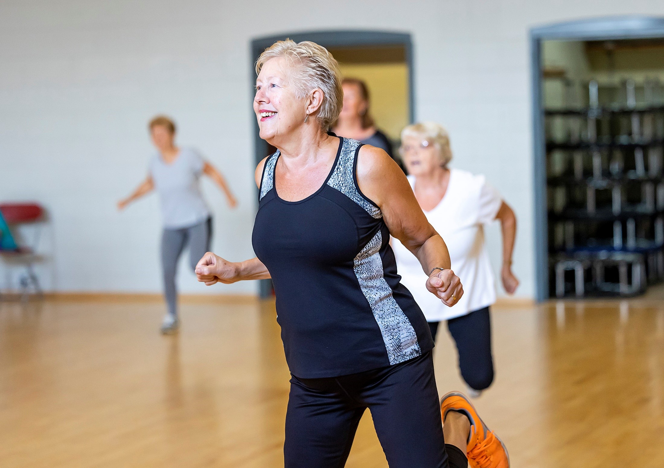 Group of ladies over 60 enjoying an aerobics class as part of the Shine programme