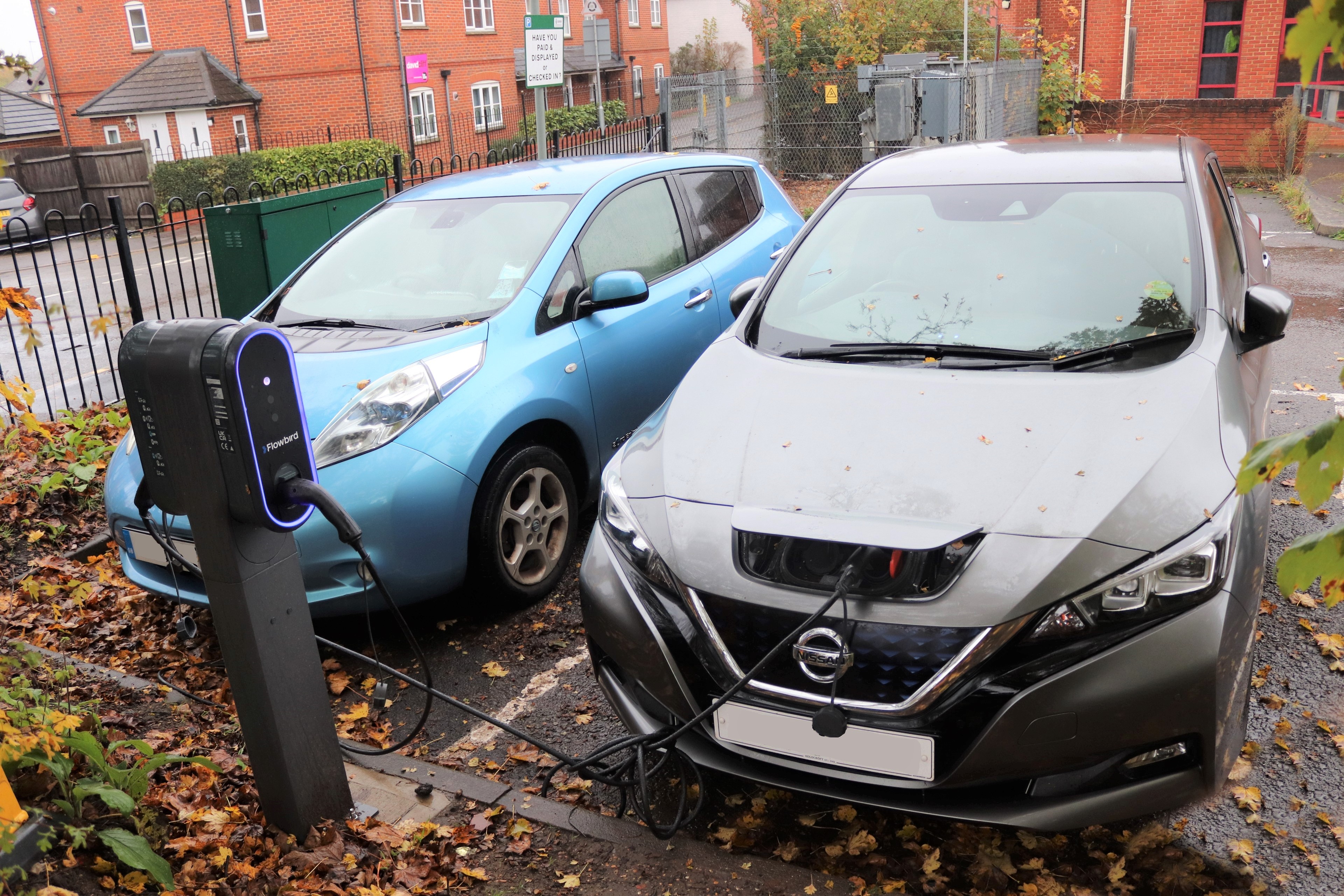 Two cars plugged into an electric chargepoint