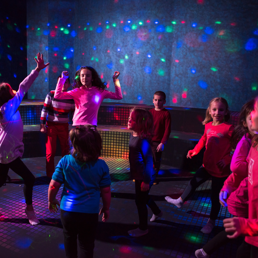 Group of children dancing at a disco