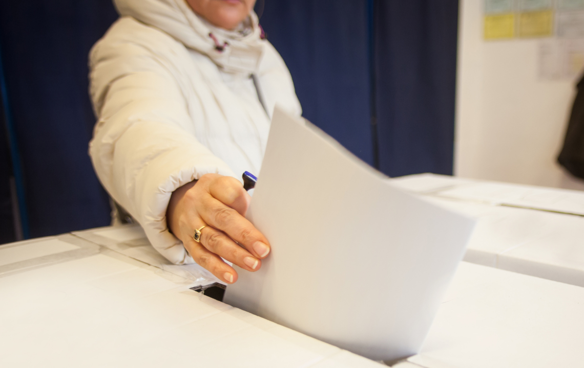 Person voting at a polling station