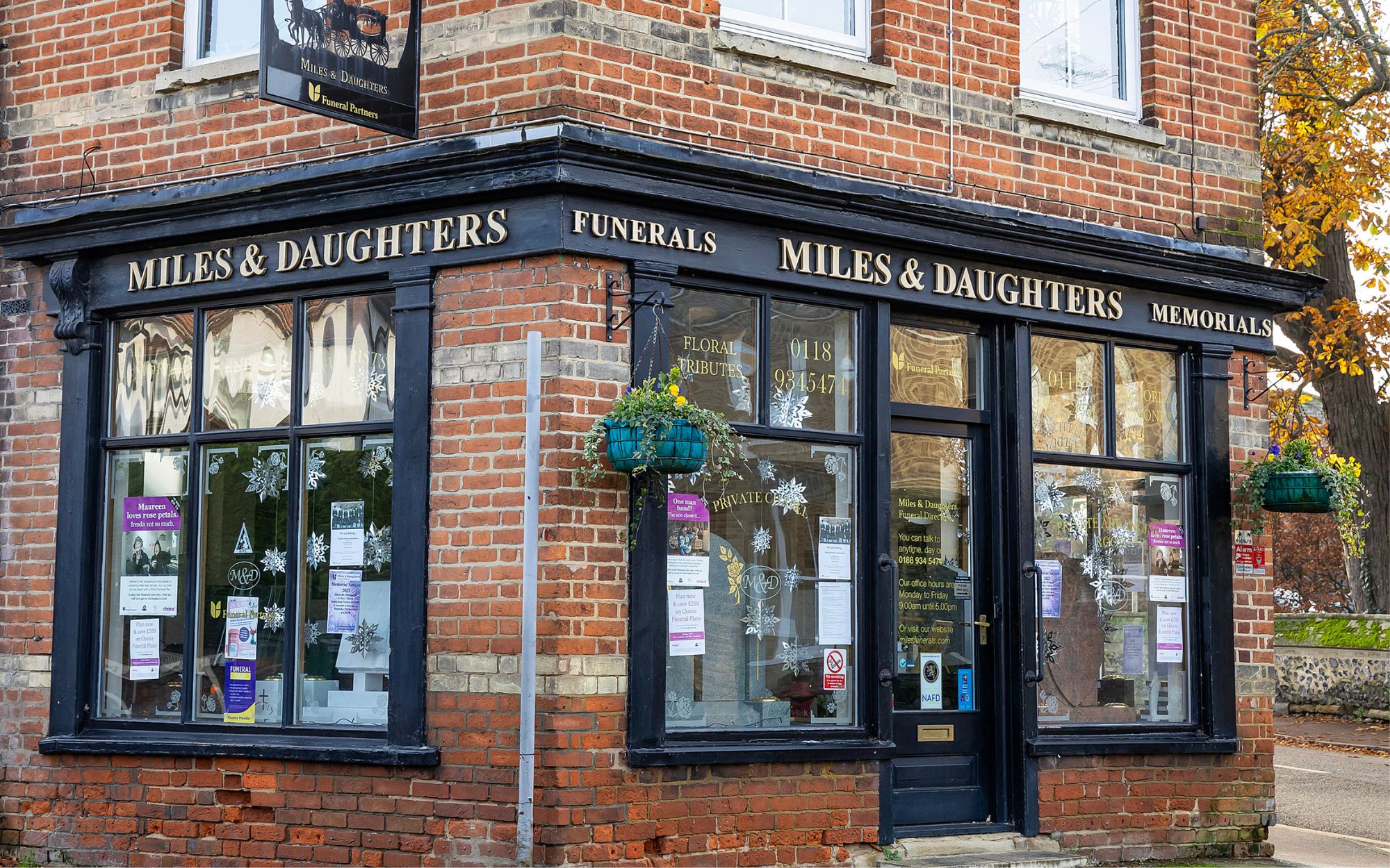 Christmas window display of Miles and Daughters Funeral Directors