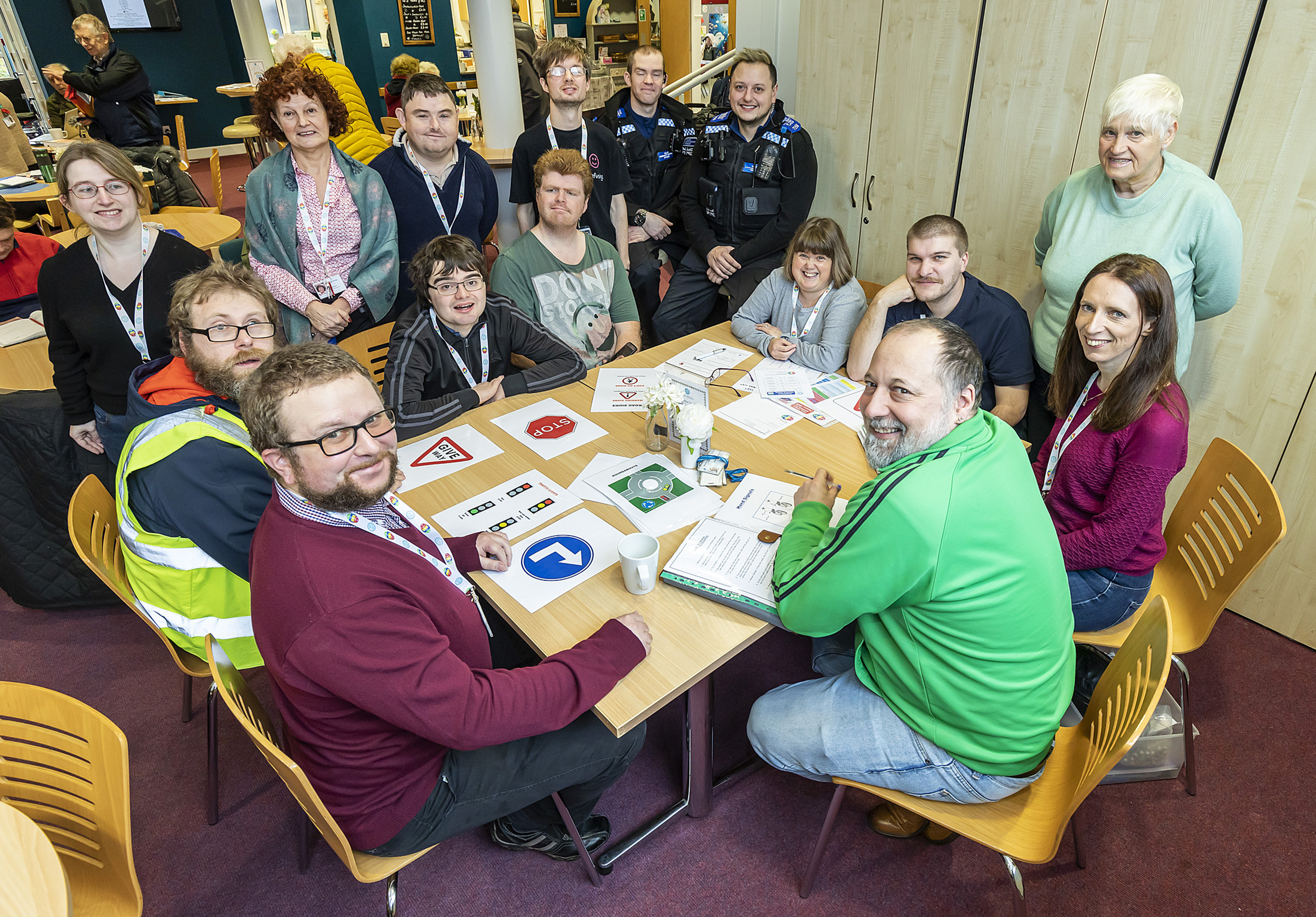 Members of CLASP, a group for adults with learning difficulties, sitting with Thames Valley Police who visited to give a talk on road safety