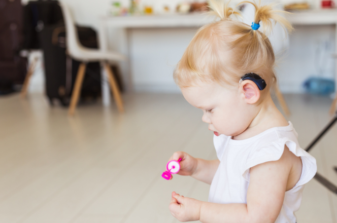 Young girl with hearing aid