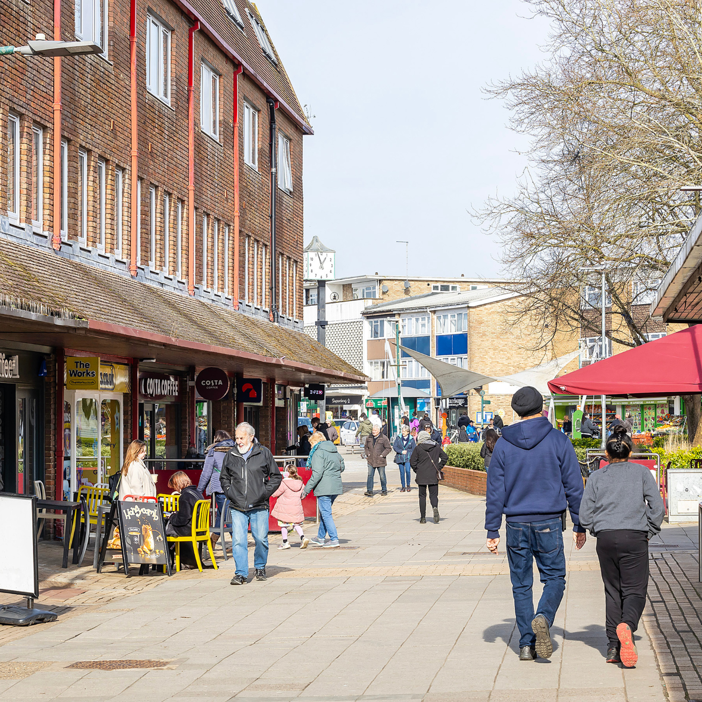 People walking down Woodley High Street
