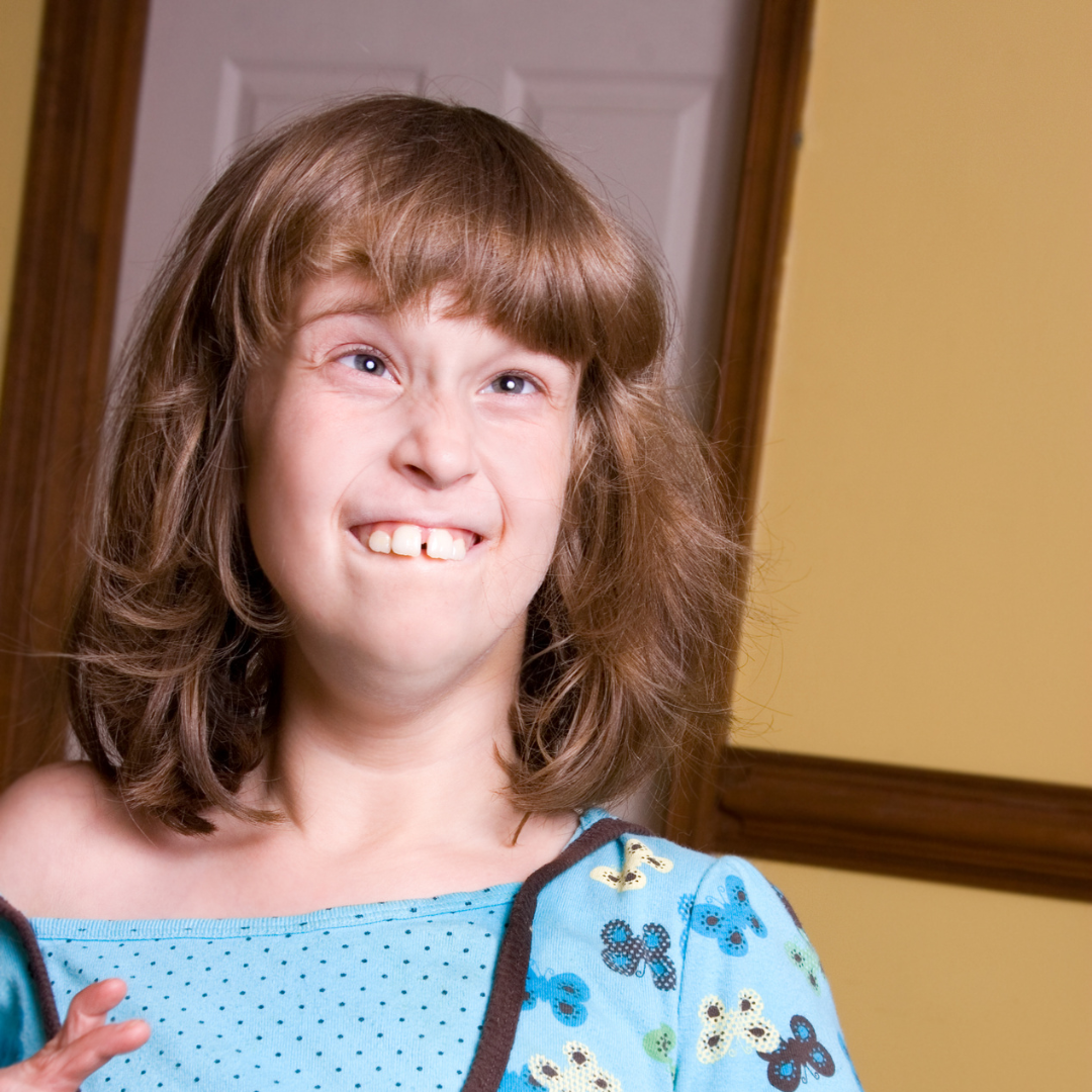 Young girl smiles at the camera